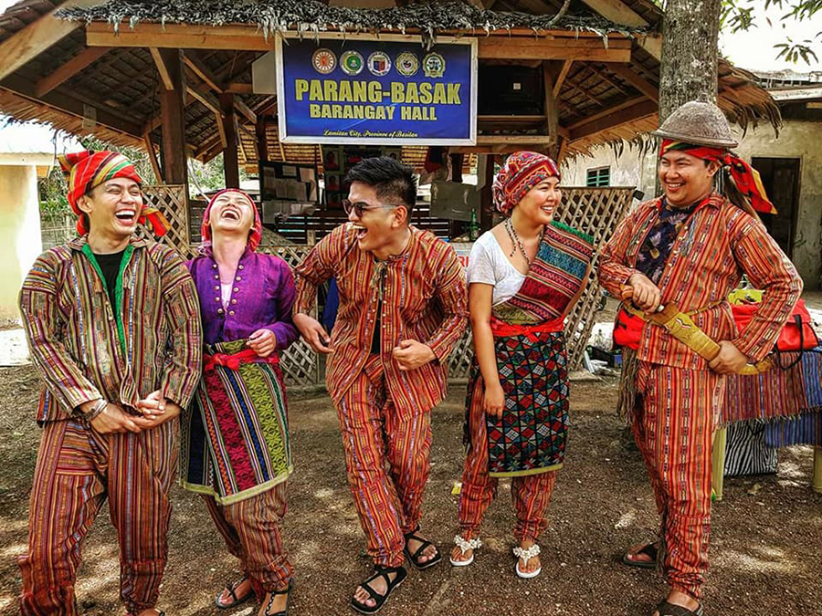 Gian (leftmost) and others try out indigenous fashion in the second-ever Random Road Trip to Mindanao