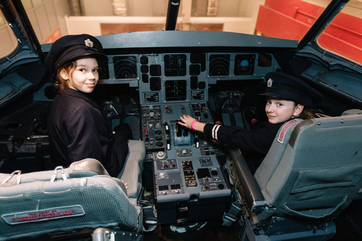 british airways kids as pilots in cockpit