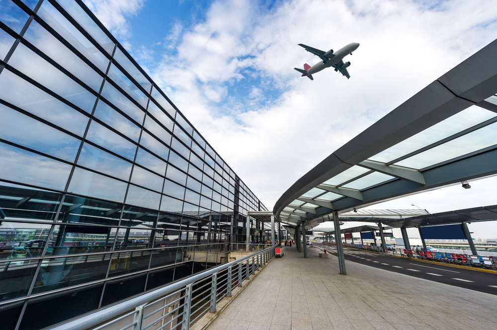 airplane flying out of shanghai airport