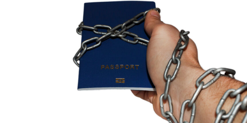 Passport,And,Hand,Linked,By,Chain